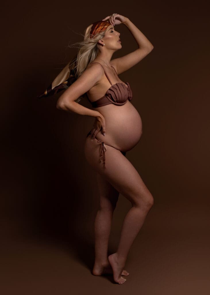 Pregnant woman in brown bikini